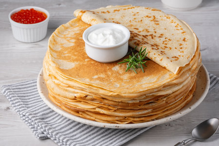 Freshly baked pancakes with sour creamの写真素材