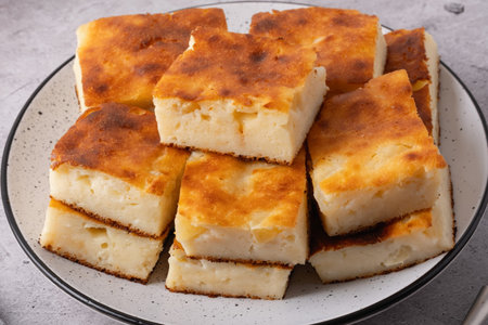Slices of homemade apple pie lie on a gray plate. Close-up.の写真素材