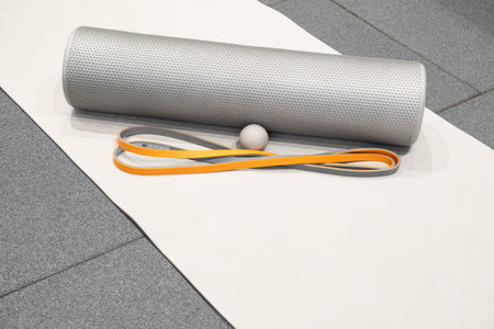Exercise equipment on mat in gym for stretching and fitness routine in a training sessionの写真素材