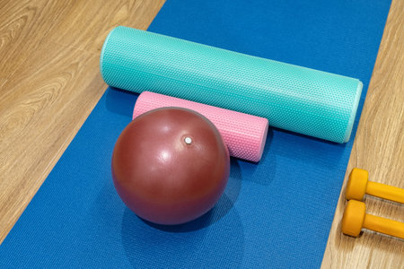 Workout tools arranged on a mat in a fitness space for exercise and training routines at homeの写真素材