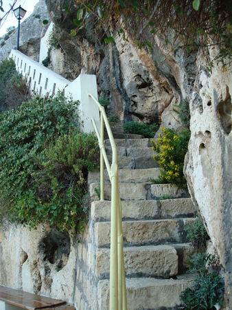 Stone stairway to cave on cliff at Xlendi, Gozo, Malta, Europeの写真素材
