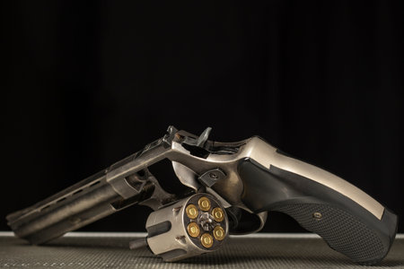 firearms shotgun revolver magazine magazine bullet concept on wooden table close up