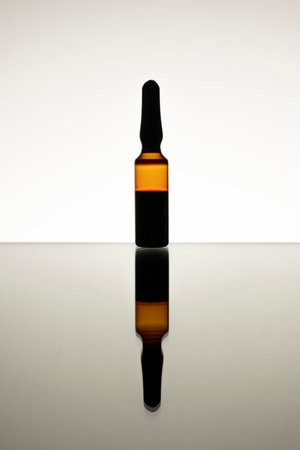 close-up medical glass ampoule bottle pandemic, epidemic, infectious or other diseases treatment drug serum syringeの写真素材