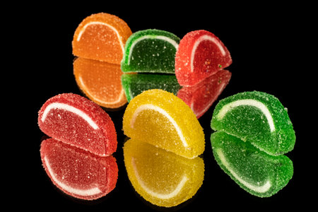 close-up black background mixed color fruit flavored sweet soft candy