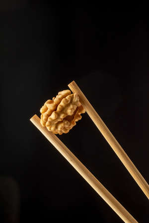 close-up black background raw delicious peeled shelled fresh walnut kernel studio conceptの写真素材