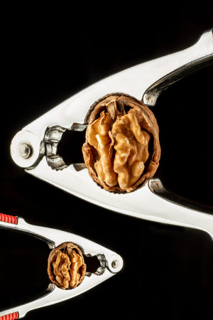 close-up black background raw delicious peeled shelled fresh walnut kernel studio concept
