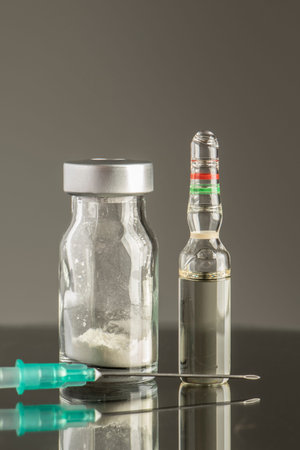 close-up studio concept vaccine material medicine bottle ampoule needle injector