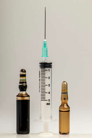 close-up studio medical equipment medicine bottle ampoule needle injectorの写真素材