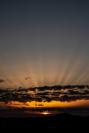 sunrise at dawn a ray of sunlight through the clouds
