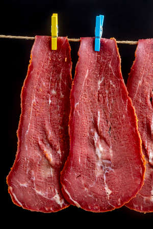Close-up detail studio red meat sliced lined up fenugreek stripped local kayseri ribeye baconの写真素材