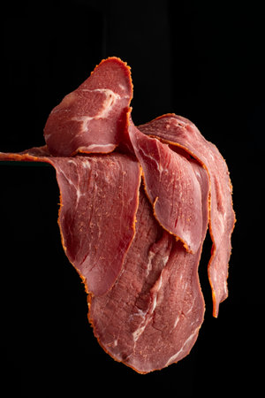 Close-up detail studio red meat sliced lined up fenugreek stripped local kayseri ribeye baconの写真素材