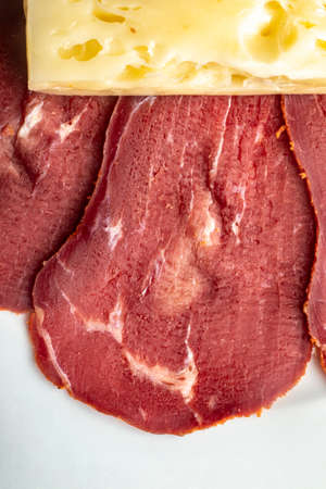 Close-up detail studio red meat sliced lined up fenugreek stripped local kayseri ribeye baconの写真素材