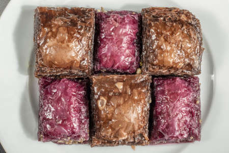 Close-up white plate healthy diet dessert chocolate mormiks turkish baklava with walnutsの写真素材