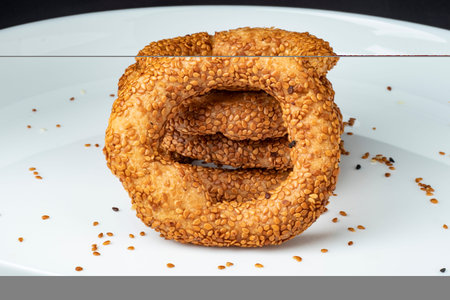 Close-up sesame plain Turkish bagel Islamic special day bagel stacked on top of each other