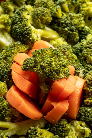 close-up plate of boiled vegetables broccoli and carrot healthy diet foodの写真素材