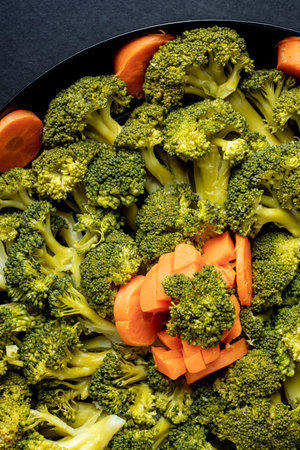 close-up plate of boiled vegetables broccoli and carrot healthy diet food
