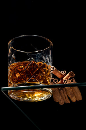 close-up shot of black ground cinnamon flavored whiskeyの写真素材