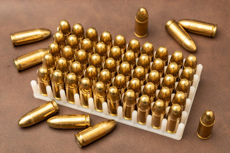 group of close-up 9mm revolver pistols and bullets
