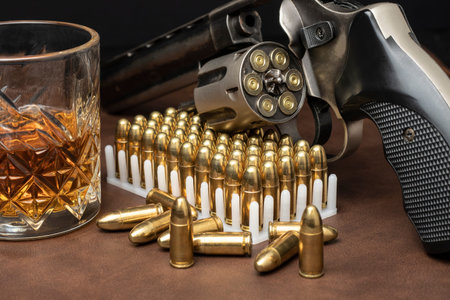 group of close-up 9mm revolver pistols and bullets
