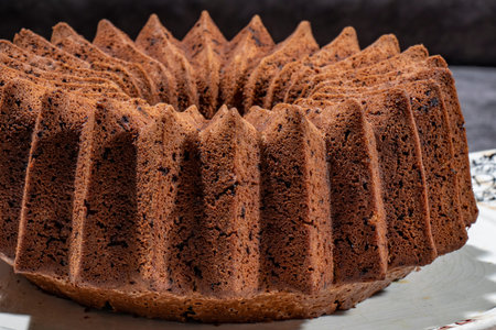 Cocoa cake with coconut chocolate cream and prepared in a close-up shaped round mold