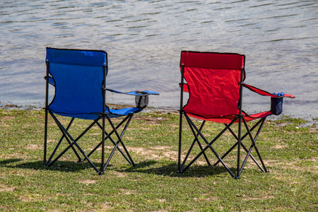 outdoor woodland dam lakeside holiday chair umbrella anglingの写真素材