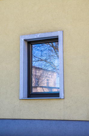 Vintage window mirroring cityの写真素材