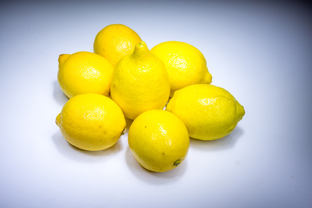 Fresh lucky seven lemons in lightの写真素材