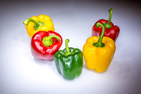 Real beautiful five bell paprikas painted with lightの写真素材