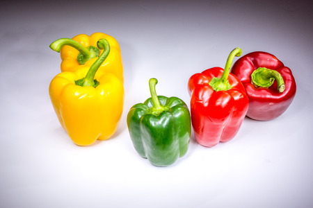 Real beautiful five bell paprikas painted with lightの写真素材