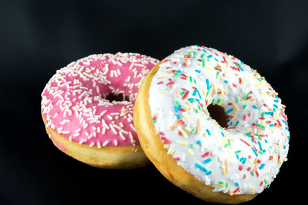 Two tasty but unhealty donutsの写真素材