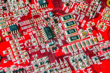 Red printed curcuit board PCB for computer components with electronic elementsの写真素材