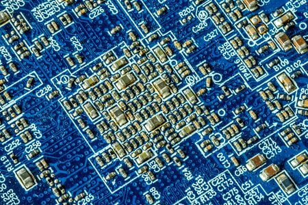 Blue printed curcuit board PCB for computer components with electronic elementsの写真素材