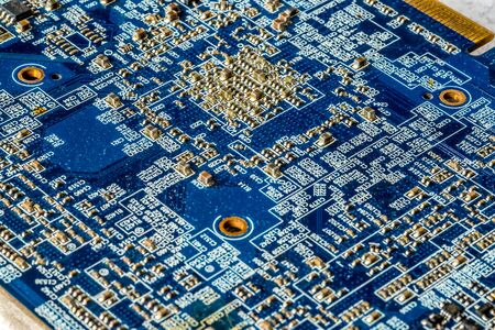 Blue printed curcuit board PCB for computer components with electronic elementsの写真素材