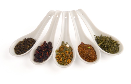  Chinese spoons with tea on white background.の写真素材