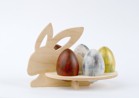 Easter wooden rabbit with eggsの写真素材