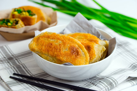 Chinese chives boxes - homemade pan fried chive dumplings in white bowl