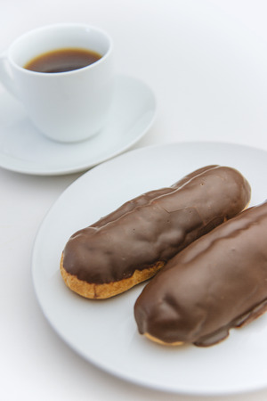 Eclair topped with chocolate and coffeeの写真素材