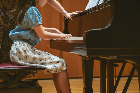 The girl who lesson in playing the pianoの写真素材