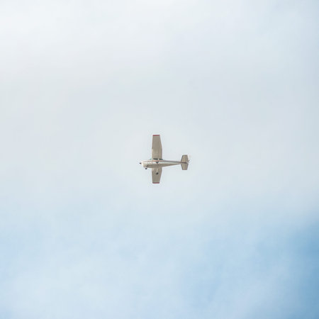 Flying small plane in the sky