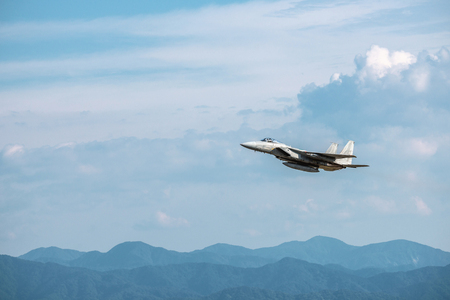 The fighter plane which flies in the blue skyのeditorial素材