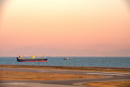 Evening view of the marine cargo boat and runway in Kobe, Japanのeditorial素材