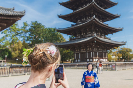 Beautiful back figure of the kimono woman in Naraのeditorial素材