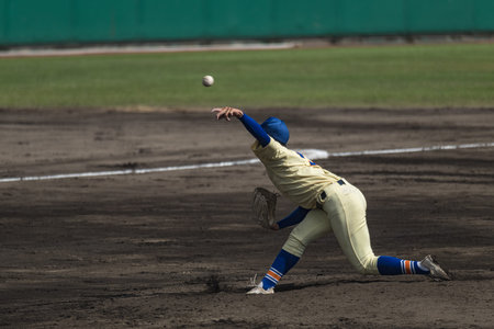 Baseball player in action during a game at a baseball game.
