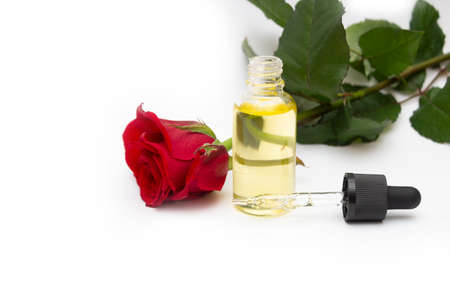 Drop bottle with rose oil. Skin care concept, hydrationの写真素材