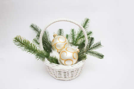 Christmas white basket with trendy gilding Christmas tree balls.の写真素材