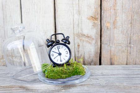 Black alarm clock on black background, copy space.の写真素材
