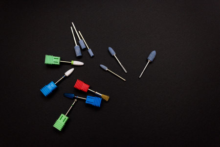 Nail tool. Cutters for hardware manicure. Accessories and nail tool on black background