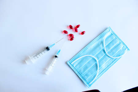 Surgical mask. Protective mask and syringe with vaccine.の写真素材