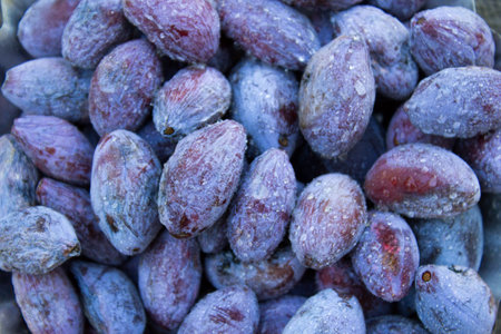 Dried plums close-up, ugly plum on a wooden table. DIY prunes.の写真素材