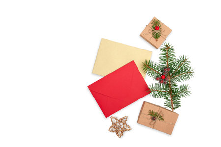 Red and golden envelopes, Christmas tree green branch and craft gift boxes isolated on white...